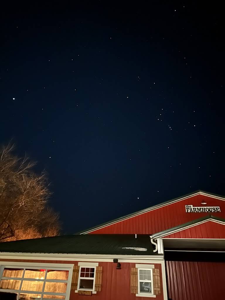 Bella's red barn beneath the night sky