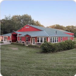 An exterior view of Bella's red farmhouse venue