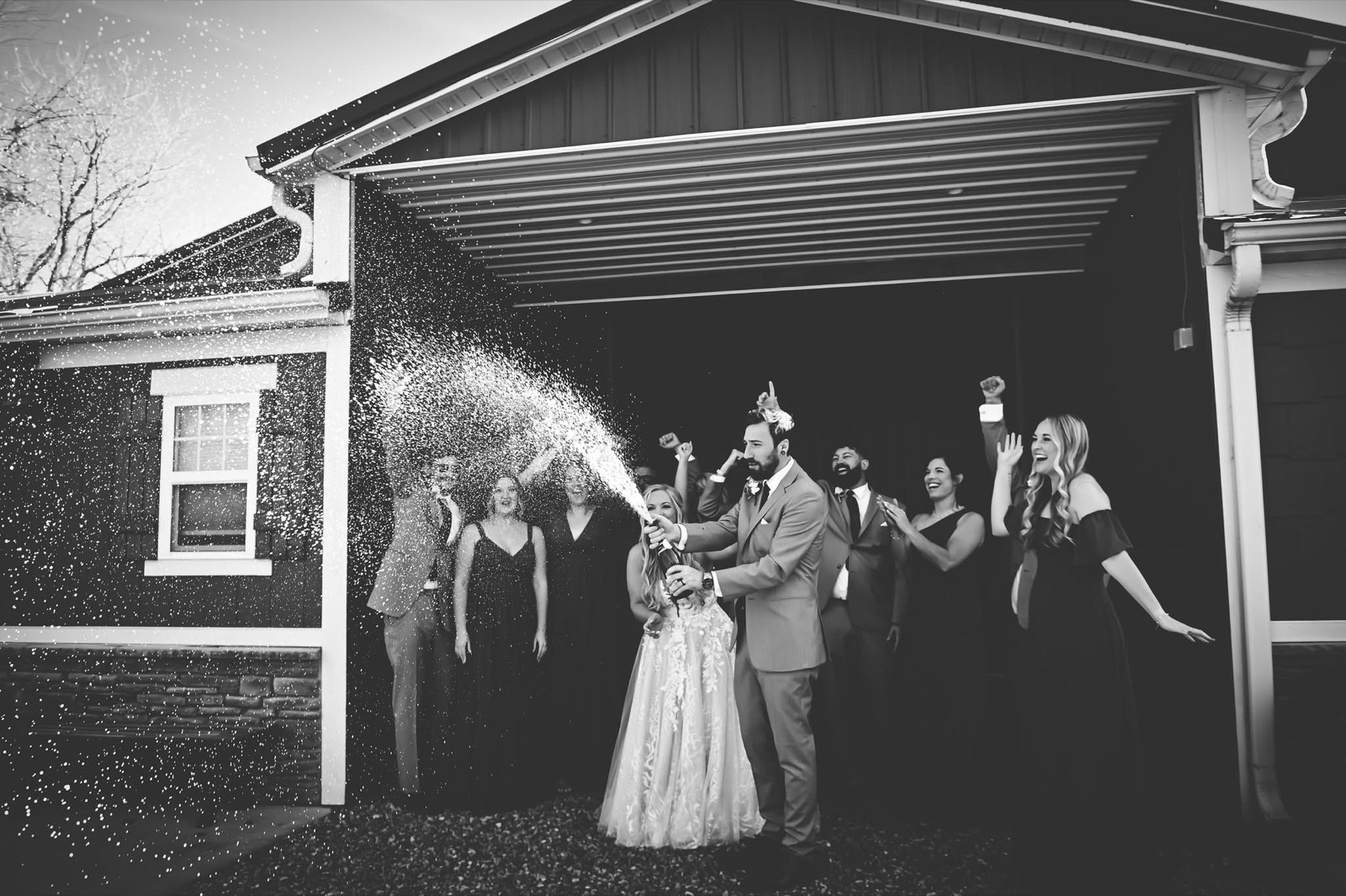 A newly married couple celebrating their grand exit at Bella's Farmhouse