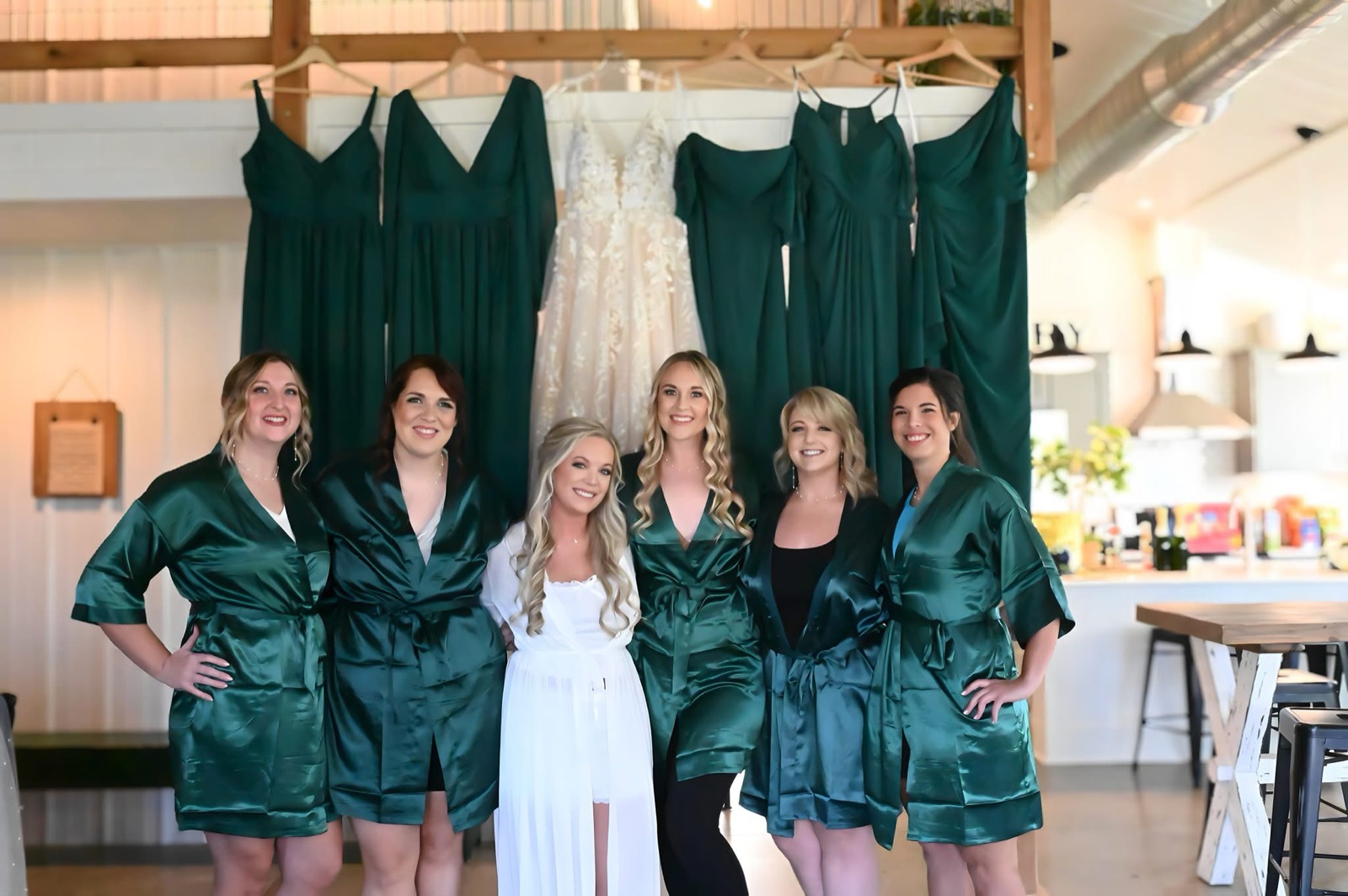 A bride and her wedding party getting ready inside the Farmhouse Suite at Bella's