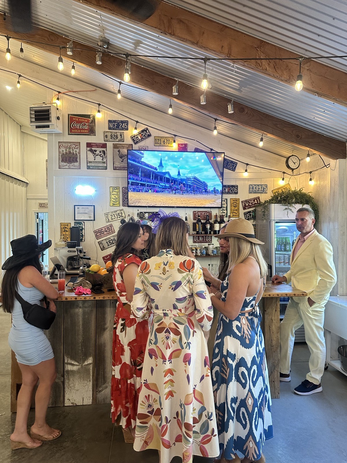 Wedding guests gathered at Bella's Farmhouse bar