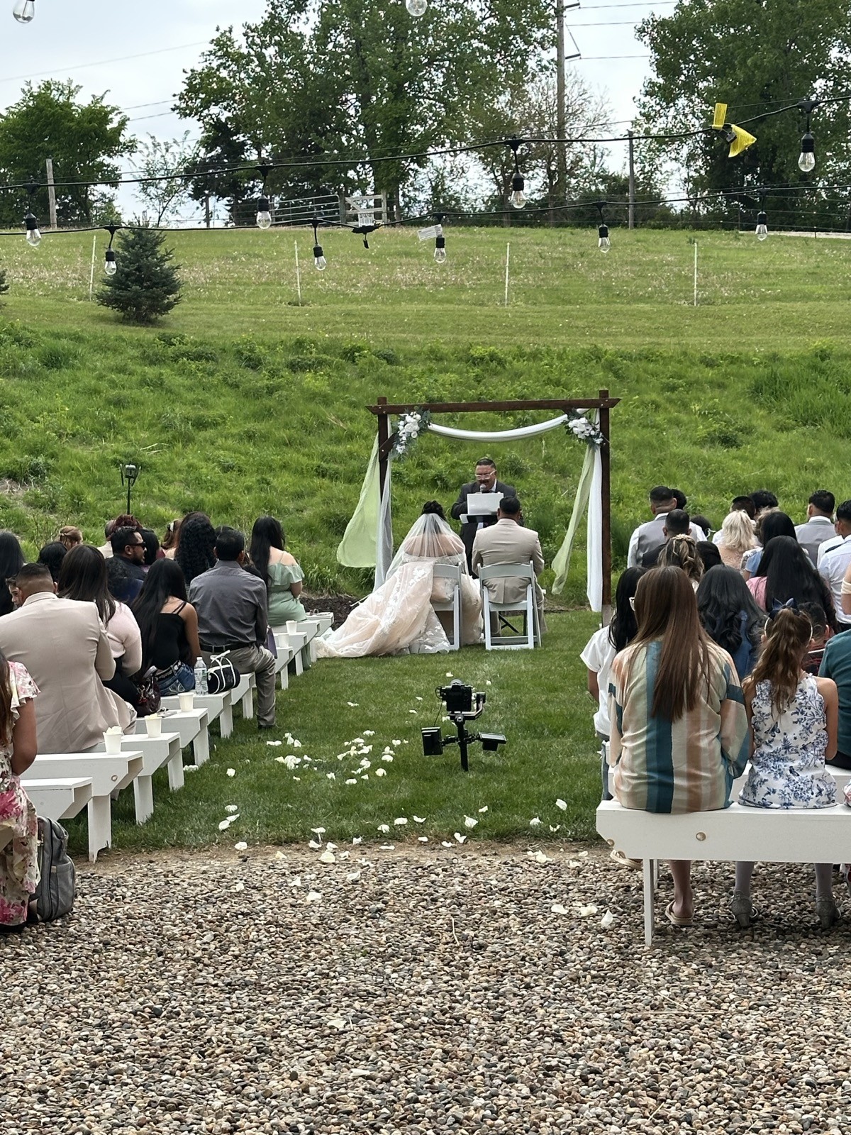 Outdoor wedding ceremony at Bella's Farmhouse in Norwalk, Iowa