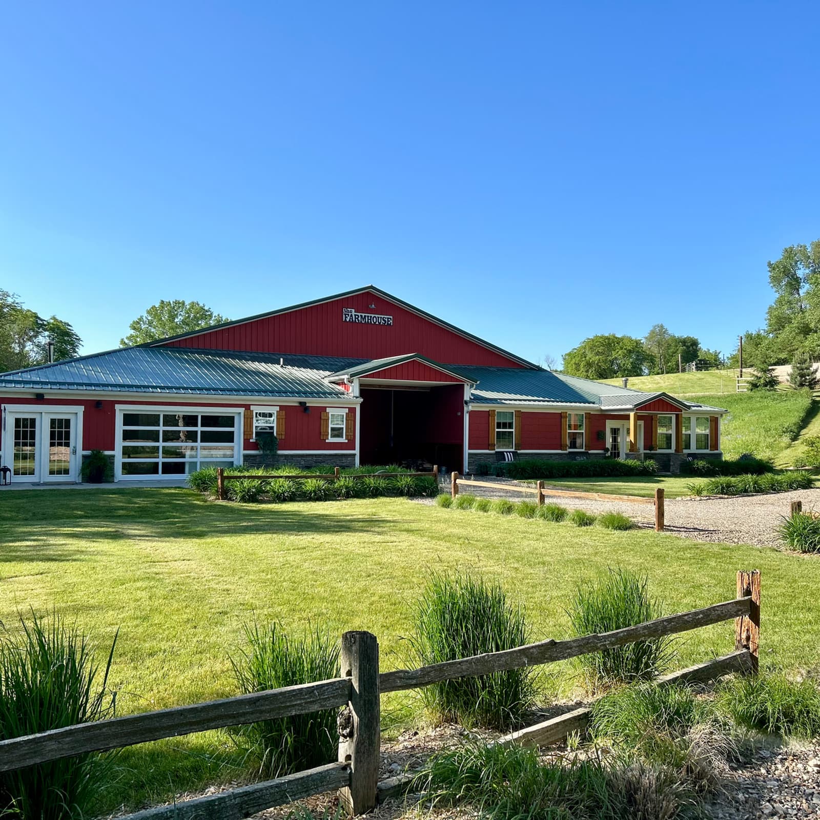 Bella's Farmhouse wedding venue at dusk, Norwalk Iowa